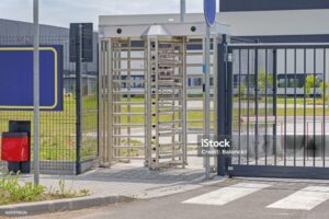 Employee Entrance Turnstile Doors at Factory Gate Fence